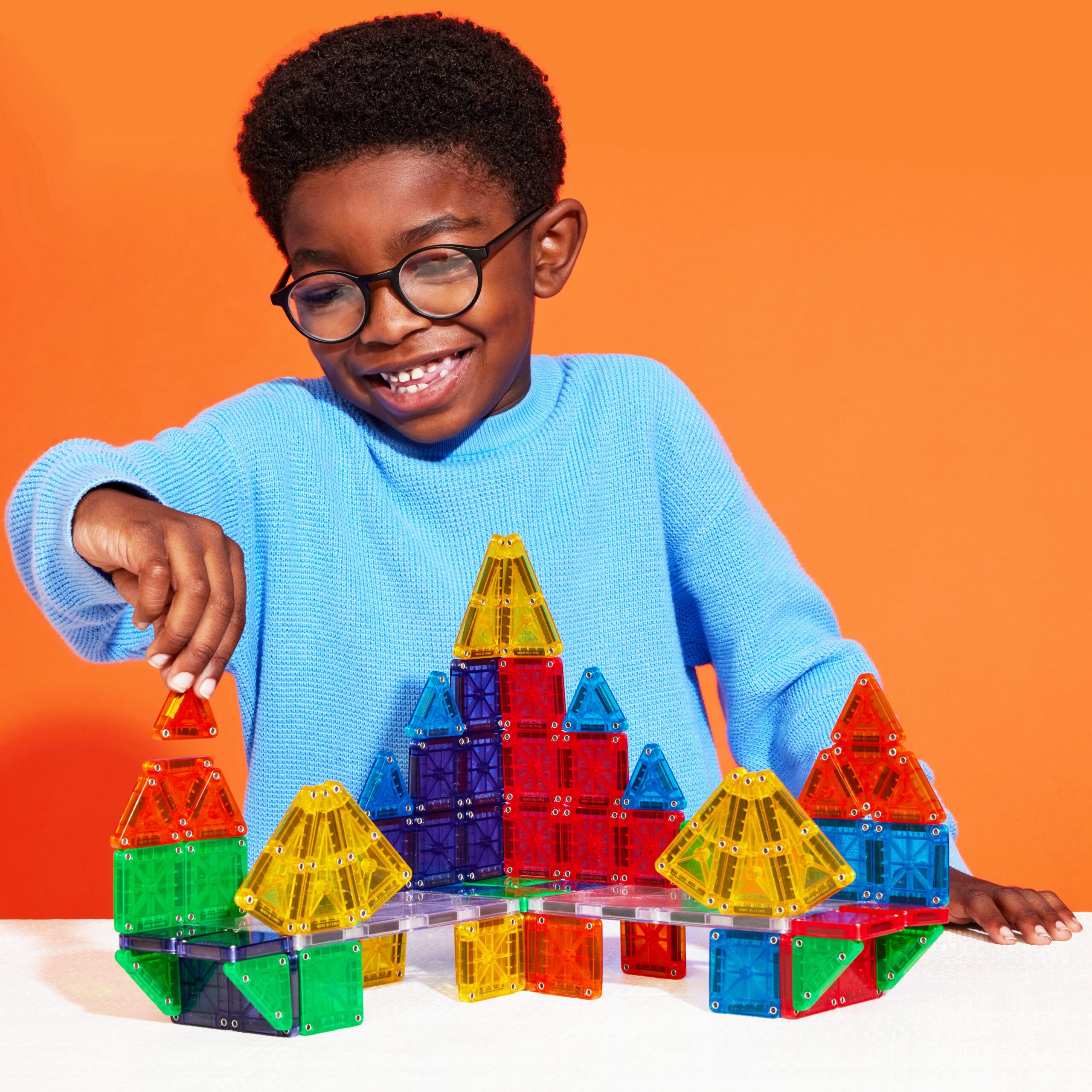 Child playing with microMAGS 70-PIece Set