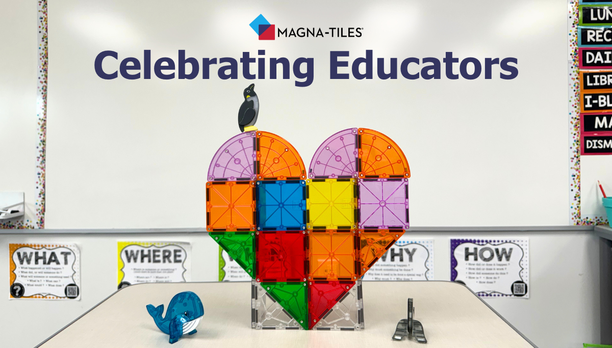 Heart-shaped Magna-Tiles sculpture on a classroom table with a small blue toy whale and a whiteboard banner reading "Celebrating Educators"