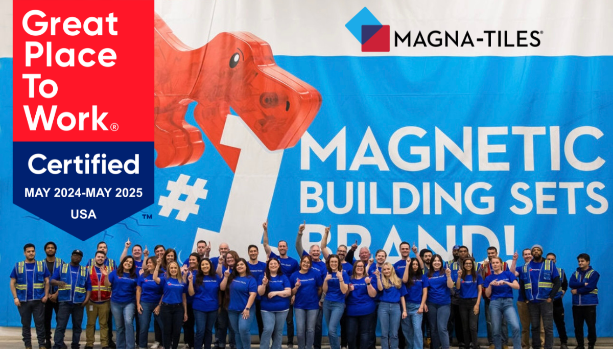 Magna-Tiles team posing before a banner that reads MAGNETIC BUILDING SETS BRAND with Great Place To Work Certified seal