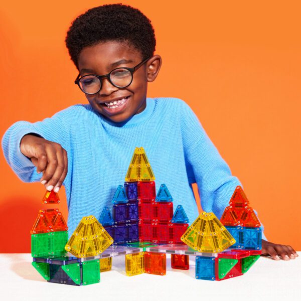 Child playing with microMAGS 70-PIece Set