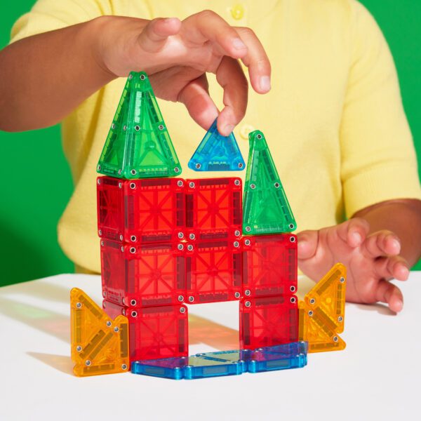 Child playing with microMAGS travel set